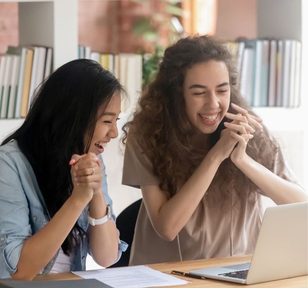 Two women candidates laughing together